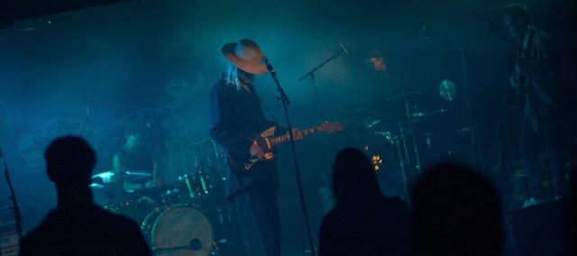 The band, looking tough